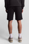 Back image of a model wearing the Sweat shorts in black, by brand Lyle and scott