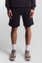 Front image of a model wearing Sweat shorts in black, by brand Lyle and scott