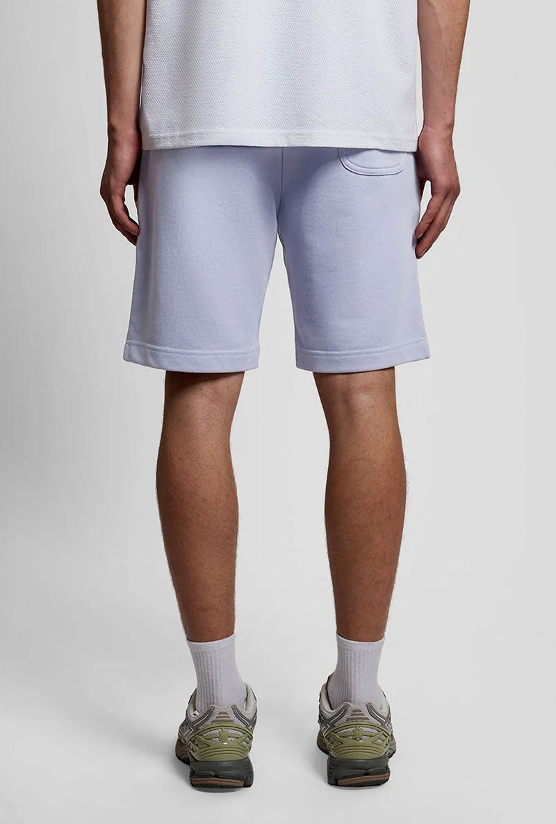 Back image of a model wearing Sweat shorts in blue, by brand Lyle and scott
