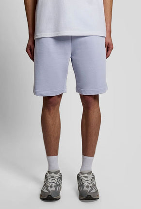 Front image of a model wearing Sweat shorts in blue, by brand Lyle and scott