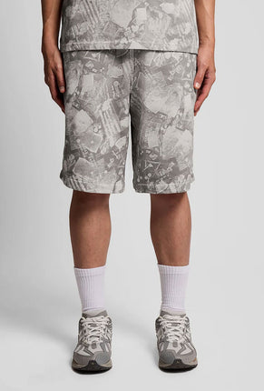Front image of a model wearing Industrial print sweat shorts in grey, by brand Lyle and scott