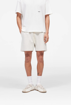 Front image of the Micro owners club mesh shorts in cream, by brand Represent