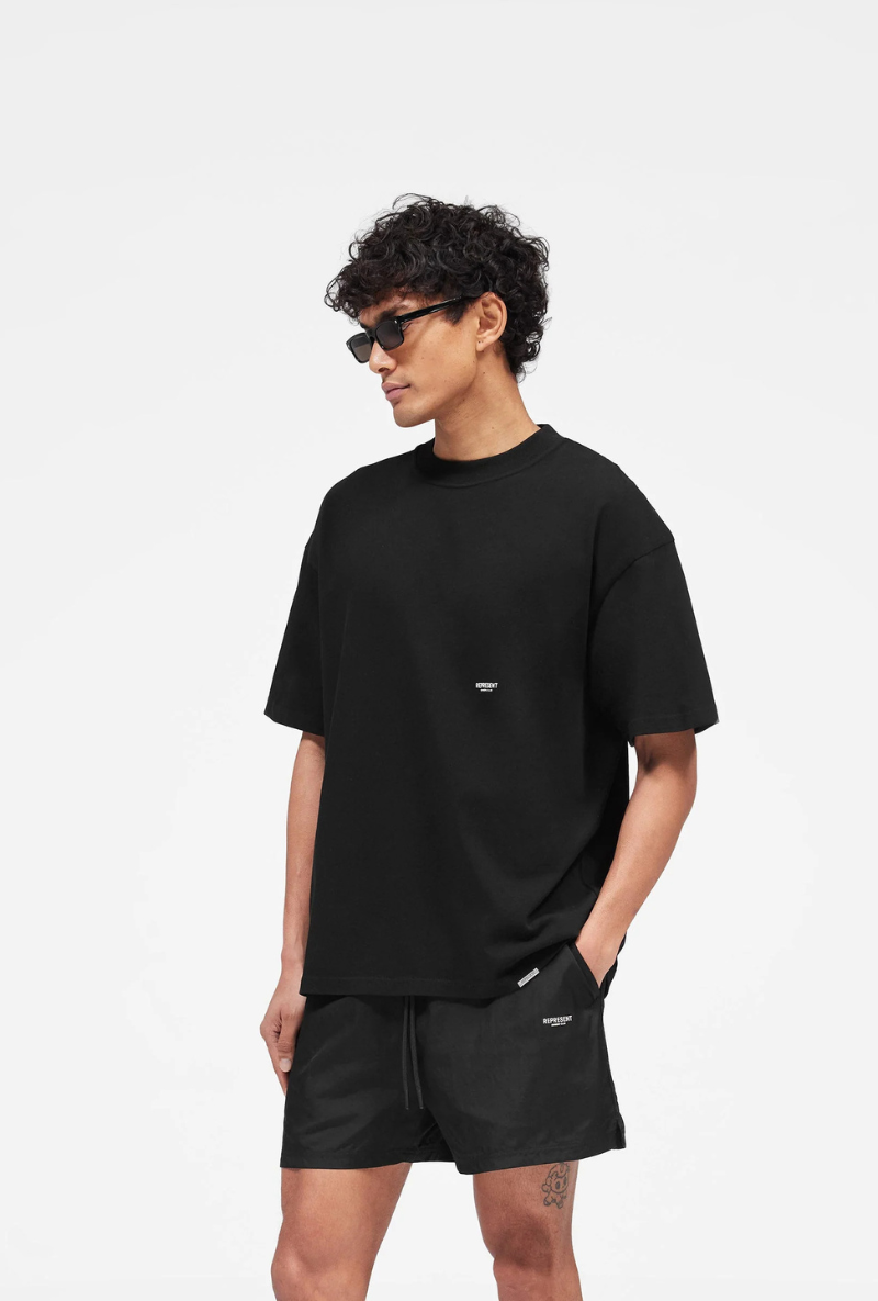 Front image of Micro owners club tshirt in black, by brand Represent