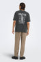 Back image of a model wearing the Fred creative washed tee in black, by brand Only and sons
