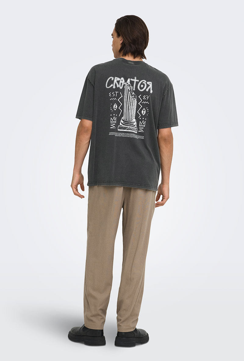 Back image of a model wearing Fred creative washed tee in black, by brand Only and sons