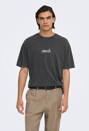 Front image of a model wearing Fred creative washed tee in black, by brand Only and sons