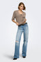 Front image of a model wearing the Bouble ss vneck button cardigan in brown, by brand Only