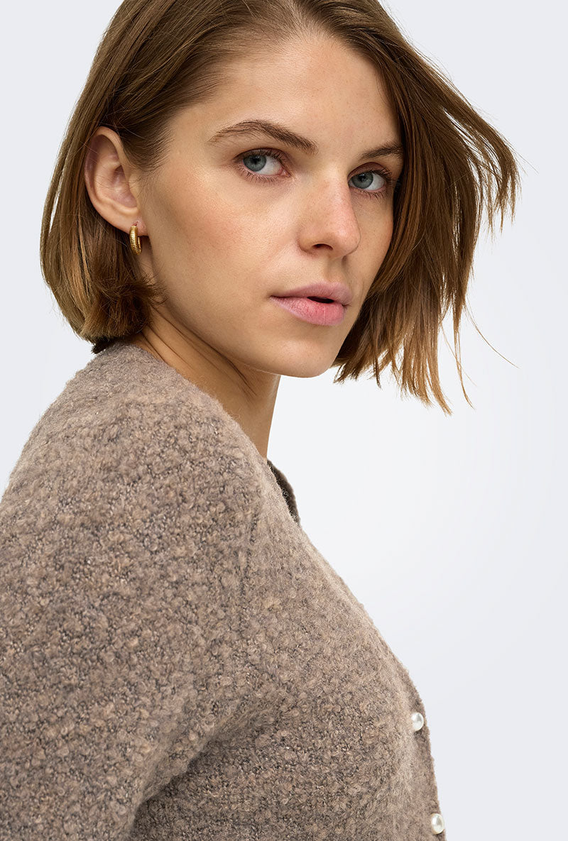 Front image of a model wearing Bouble ss vneck button cardigan in brown, by brand Only
