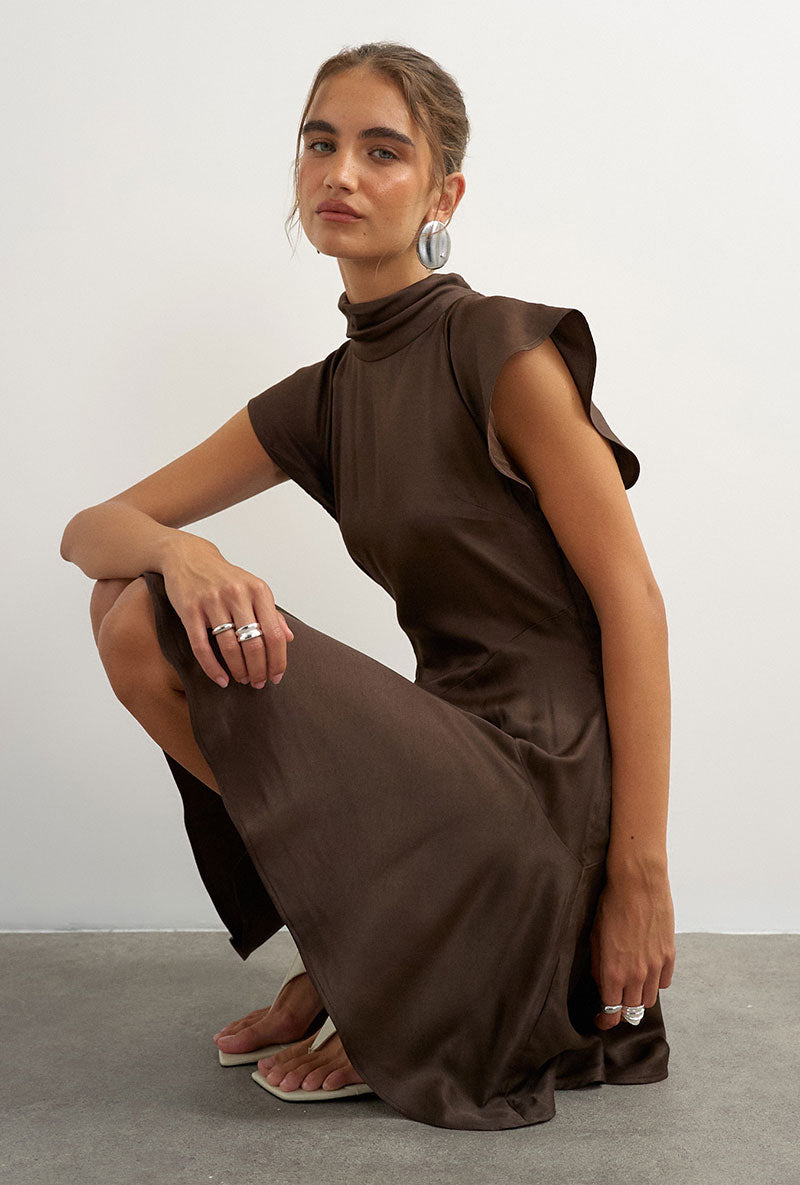 Front image of a model wearing Cilly sation flippy hem mini dress in chocolate, by brand Top shop