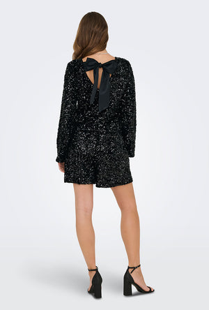 Back image of a model wearing the Confidence ls sequin bow top in black, by brand Only