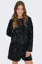 Front image of a model wearing Confidence ls sequin bow top in black, by brand Only