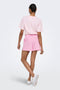 Back image of a model wearing the Filucca hw pull up shorts in pink, by brand Only