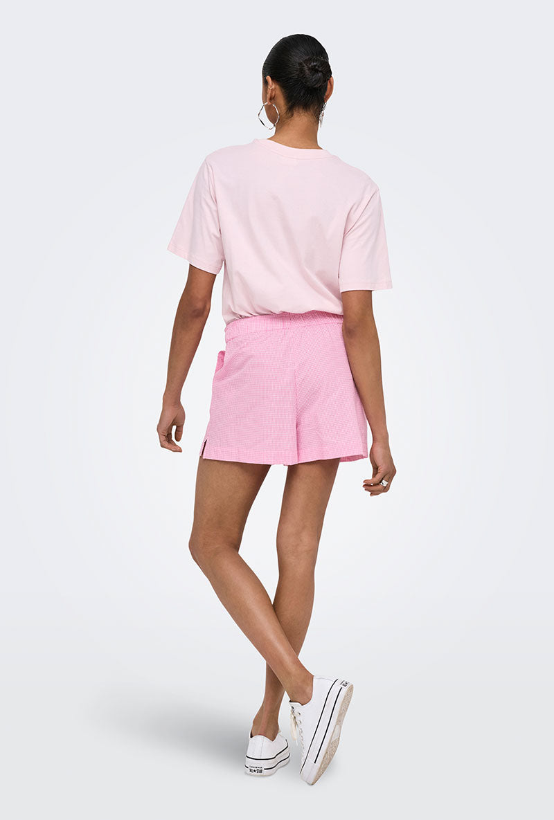 Back image of a model wearing Filucca hw pull up shorts in pink, by brand Only