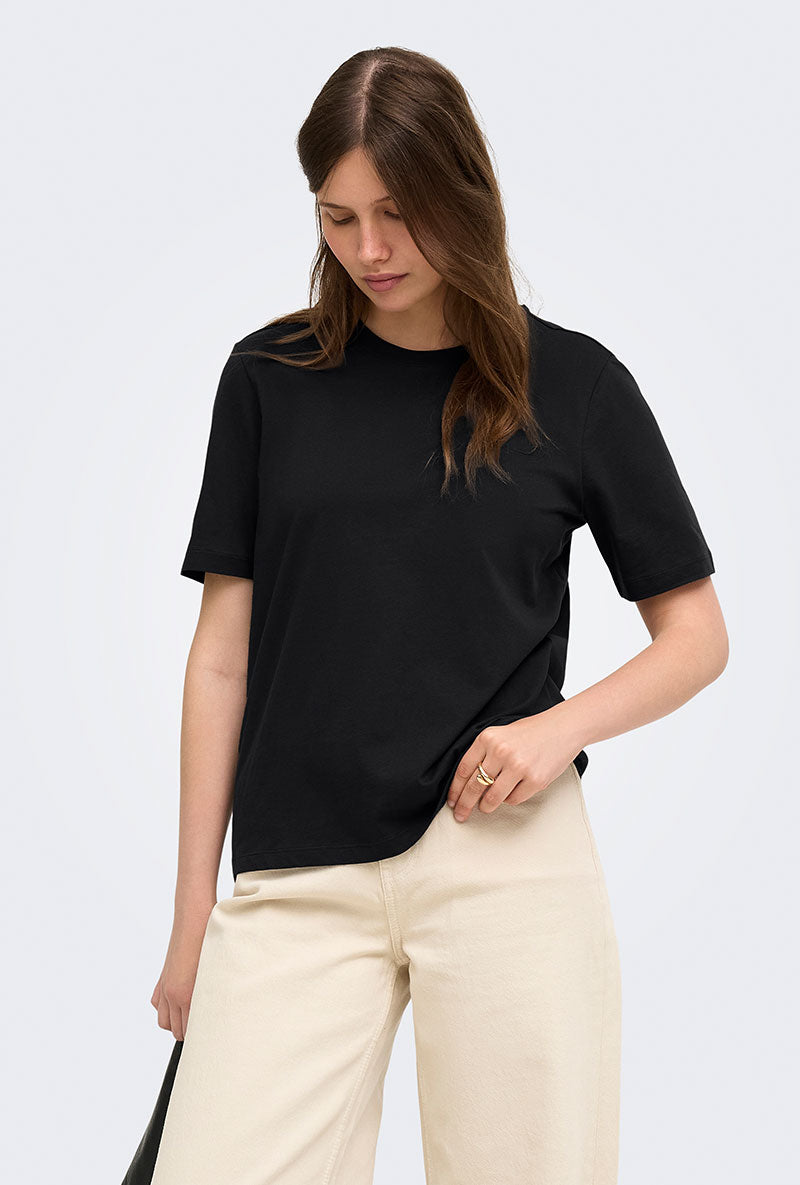 Front image of a model wearing Happy ss oneck tee in black, by brand Only