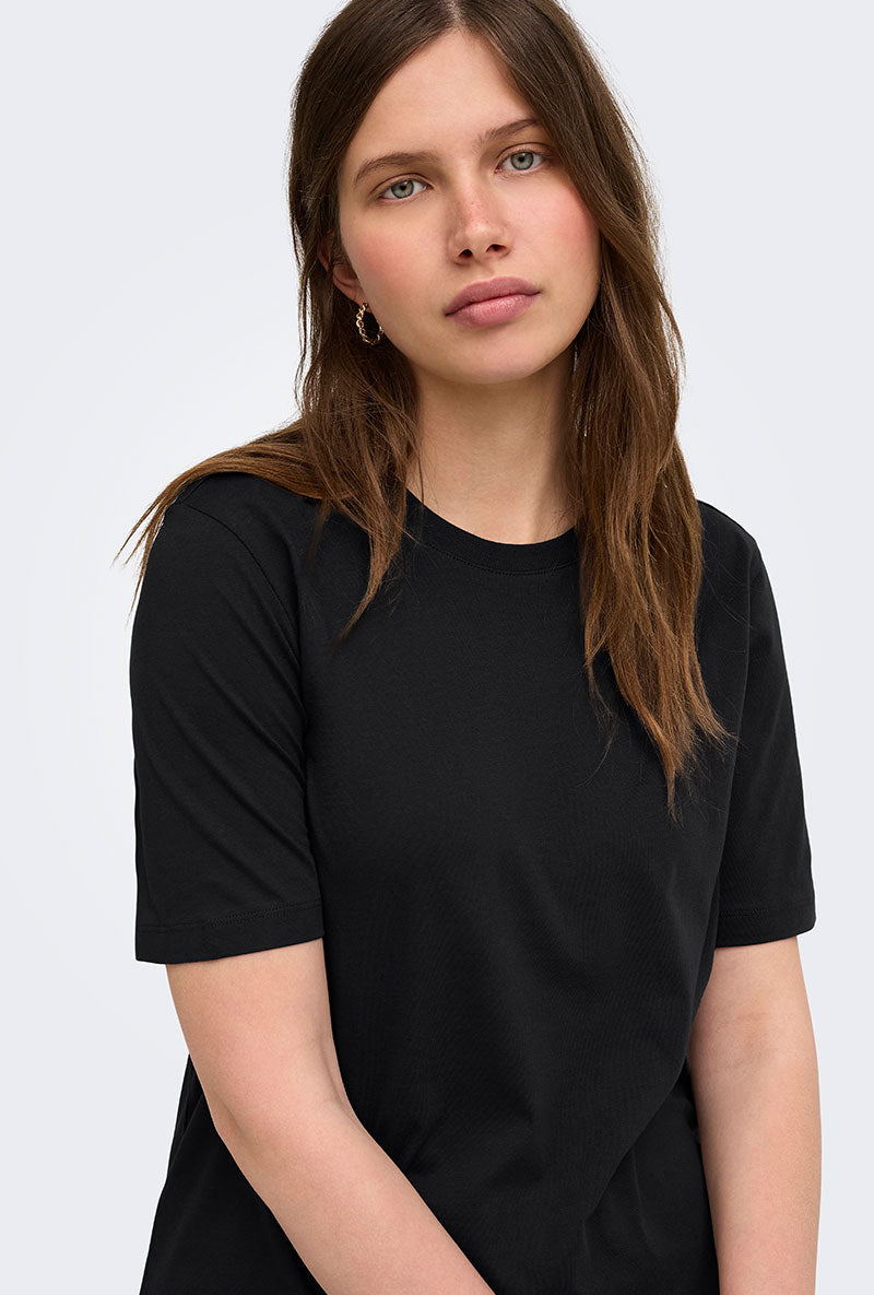 Front image of a model wearing Happy ss oneck tee in black, by brand Only