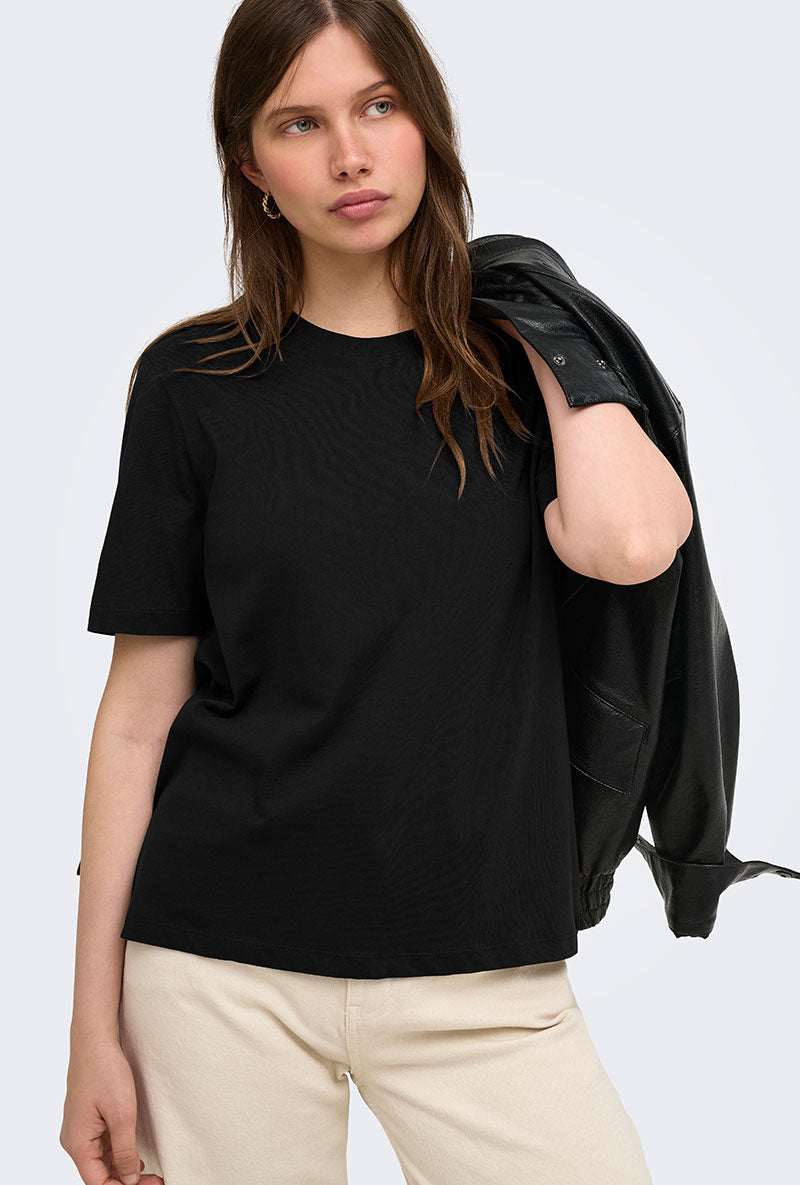 Front image of a model wearing Happy ss oneck tee in black, by brand Only