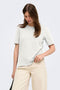 Front image of a model wearing the Happy ss oneck tee in off white, by brand Only