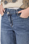 Front pocket detail image of a model wearing the Hope mw wide jeans in denim, by brand Only