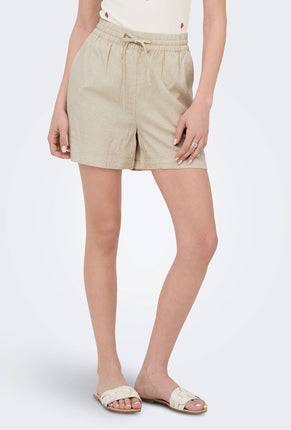 Front image of a model wearing Jdy say hw linen string shorts in oat, by brand Jacqueline de yong