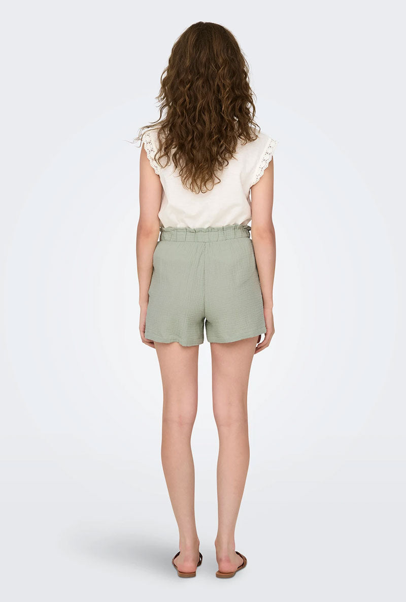 Back image of a model wearing Theis life mw shorts in sage, by brand Jacqueline de yong