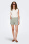 Front image of a model wearing the Theis life mw shorts in sage, by brand Jacqueline de yong