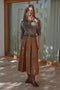 Front image of a model wearing the Laven zora hw long belt skirt in brown, by brand Only