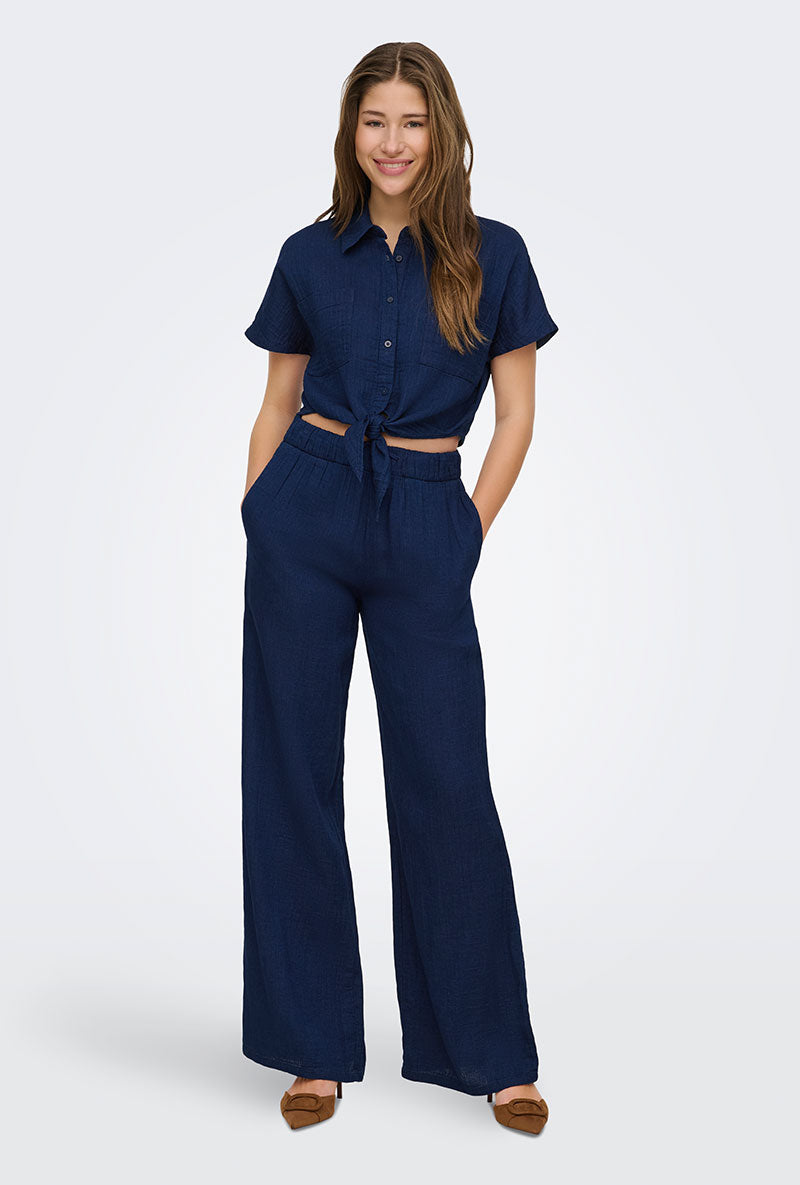 Front image of a model wearing Leoni seersucker cap knot shirt in navy, by brand Only