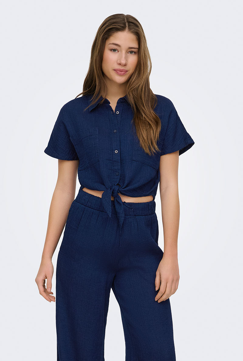 Front image of a model wearing Leoni seersucker cap knot shirt in navy, by brand Only