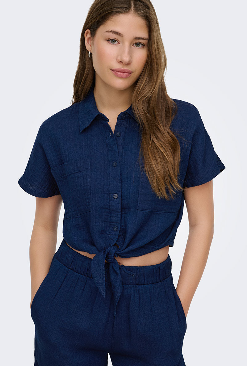 Front image of a model wearing Leoni seersucker cap knot shirt in navy, by brand Only