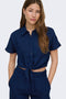 Front image of a model wearing the Leoni seersucker cap knot shirt in navy, by brand Only