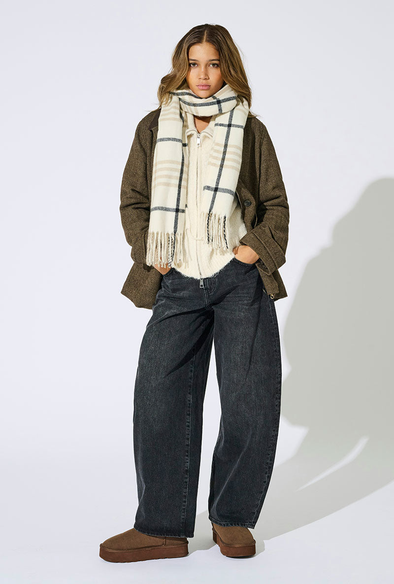 Front image of a model wearing Mathilde check fringe scarf in grey, by brand Only