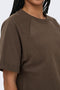 Front image of a model wearing the Ofelia ss raglan sweatshirt in brown, by brand Only