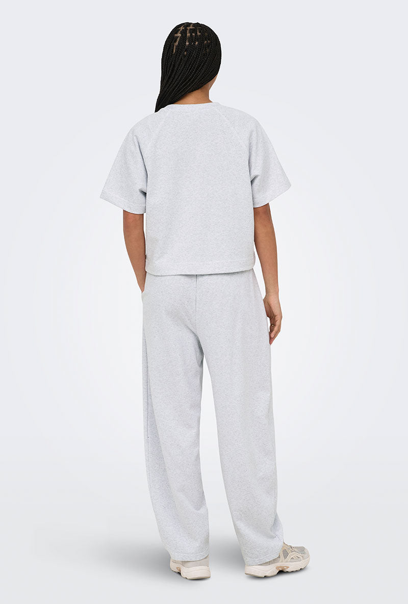 Back image of a model wearing Ofelia ss raglan sweatshirt in light grey, by brand Only