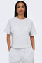 Front image of a model wearing the Ofelia ss raglan sweatshirt in light grey, by brand Only