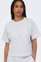 Front image of a model wearing the Ofelia ss raglan sweatshirt in light grey, by brand Only