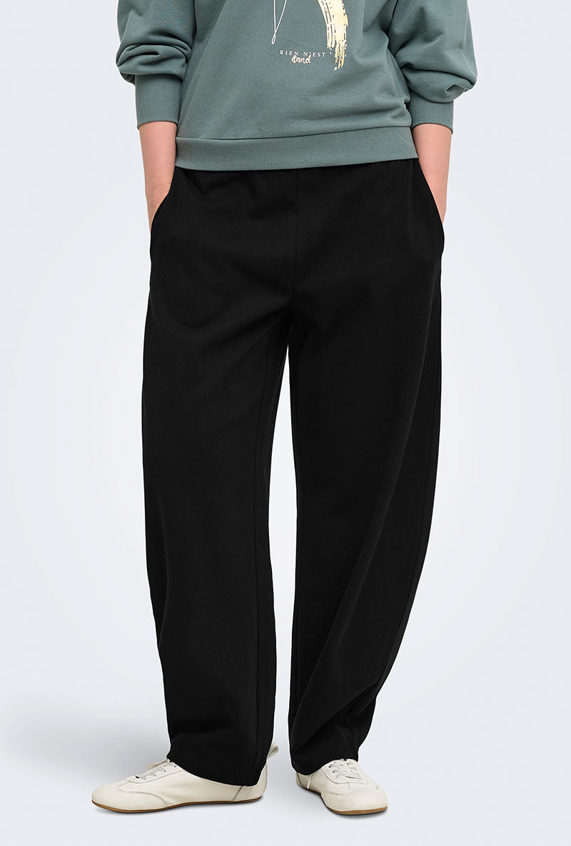 Front image of a model wearing Ofelia sweatpants in black, by brand Only