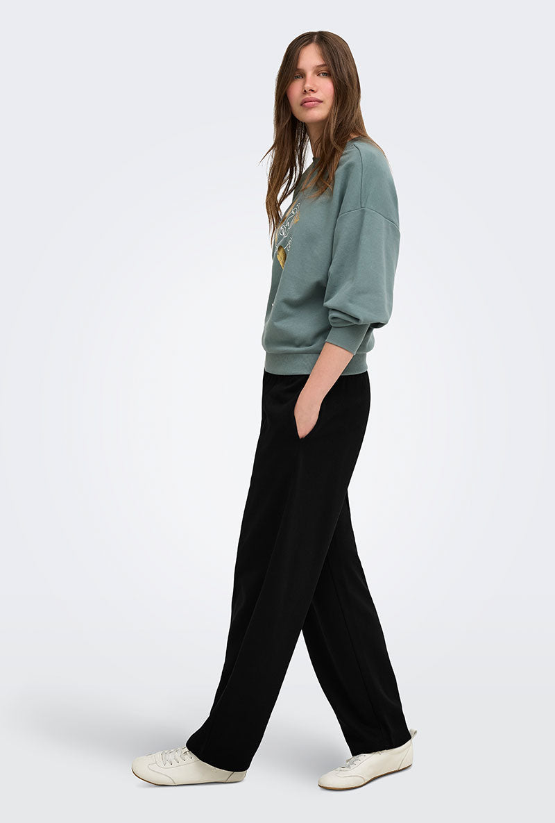 Front image of a model wearing Ofelia sweatpants in black, by brand Only