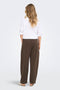 Back image of a model wearing the Ofelia sweatpants in brown, by brand Only