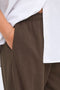 Front image of a model wearing the Ofelia sweatpants in brown, by brand Only