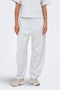 Front image of a model wearing Ofelia sweatpants in light grey, by brand Only
