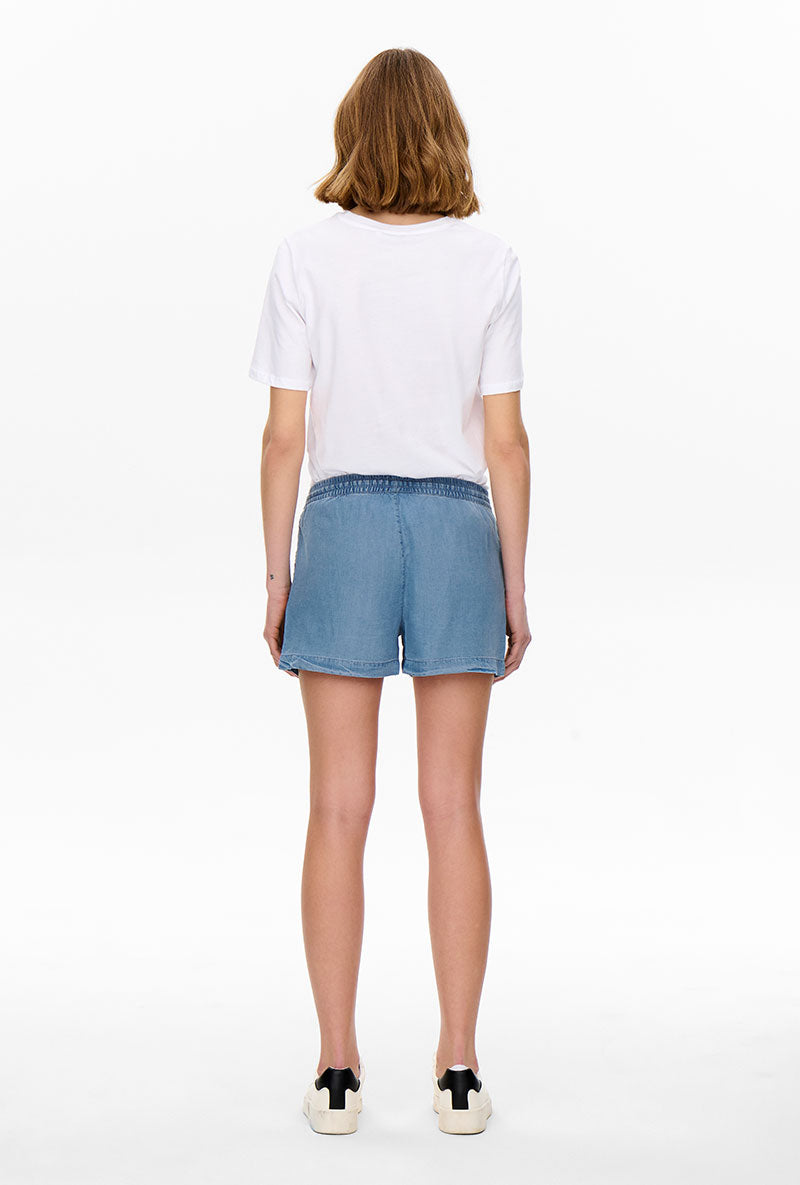 Back image of a model wearing Pema life lycell denim shorts in denim, by brand Only