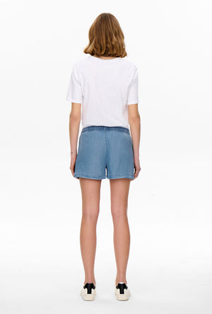 Back image of a model wearing the Pema life lycell denim shorts in denim, by brand Only