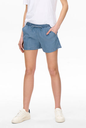 Front image of a model wearing Pema life lycell denim shorts in denim, by brand Only