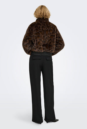 Back image of a model wearing the Rikke faux fur jacket in black, by brand Only