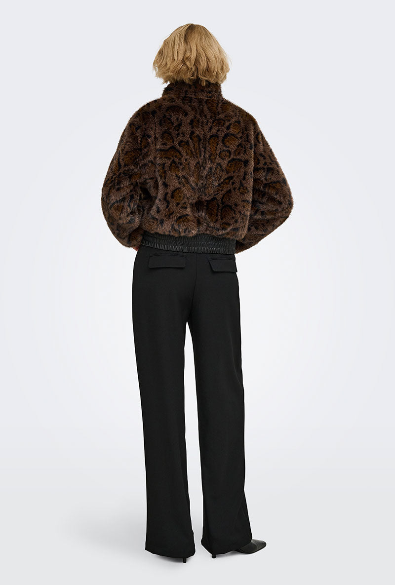 Back image of a model wearing Rikke faux fur jacket in black, by brand Only