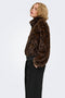 Front image of a model wearing the Rikke faux fur jacket in black, by brand Only
