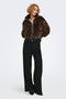 Front image of a model wearing the Rikke faux fur jacket in black, by brand Only