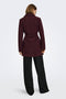 Back image of a model wearing the Trish wrap coat in chocolate, by brand Only