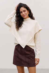 Front image of a model wearing the Camila ls cape higneck pullover in cream, by brand Vero moda
