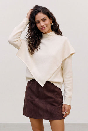 Front image of a model wearing the Camila ls cape higneck pullover in cream, by brand Vero moda